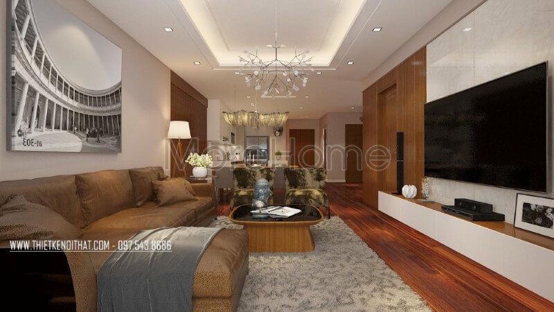 Gam màu trầm đóng vai trò chủ đạo, khiến nội thất phòng khách của chung cư góp phần tạo nên một không gian ấm cúng và thân thiện hơn cho gia chủ.